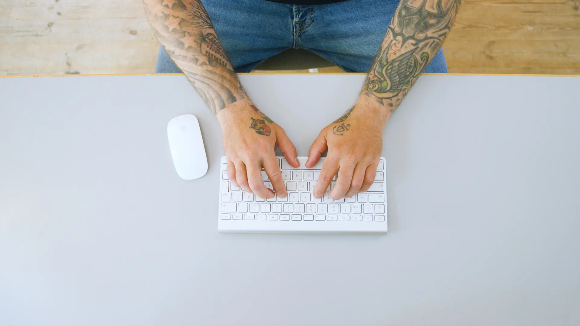 Hands typing on a keyboard