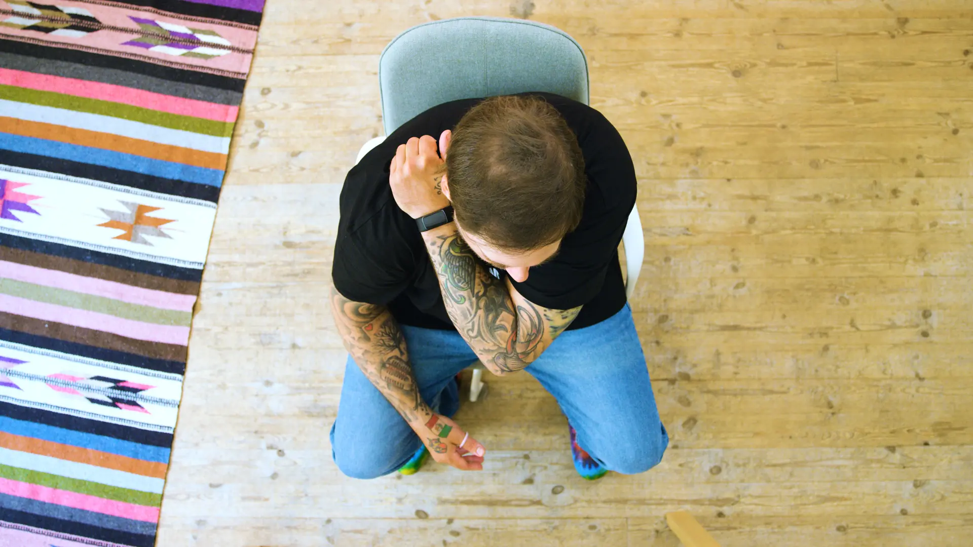 Person receiving a shoulder massage in a studio office